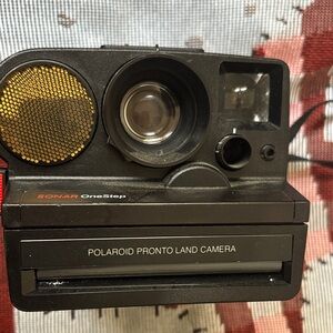 Polaroid Black Pronto Land Instant Camera with Gold Accents